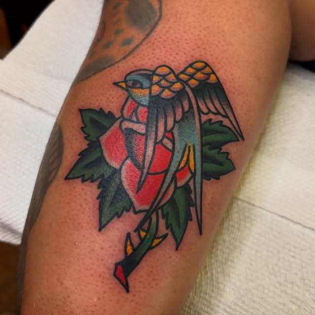 Color traditional sparrow and rose tattoo pierced by an arrow