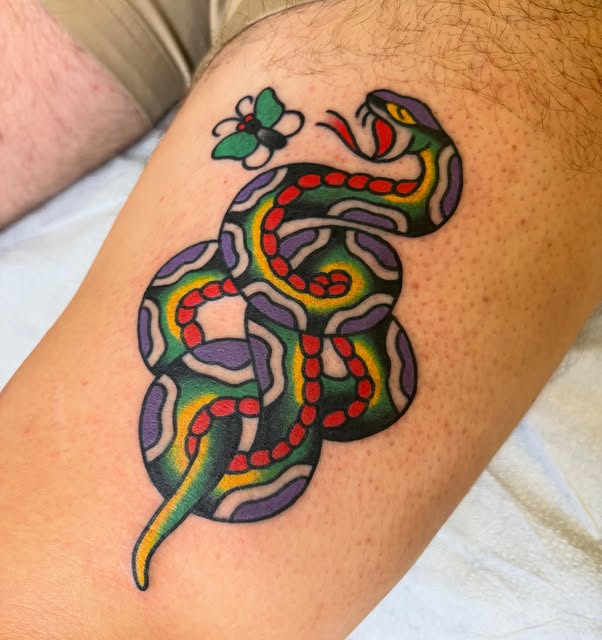 Color traditional snake tattoo with a small butterfly